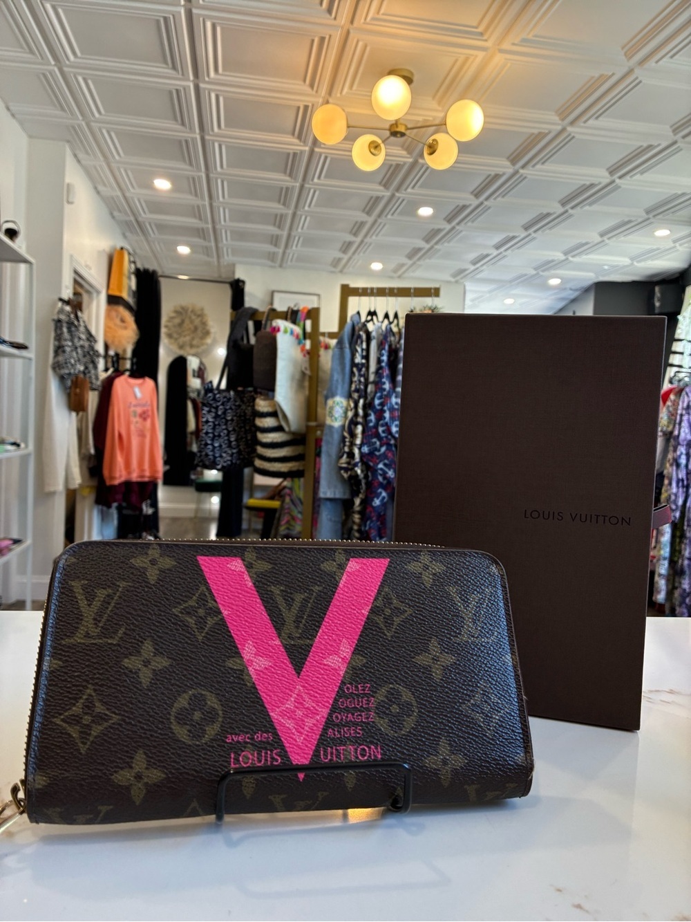 Louis Vuitton limited edition monogram V zippy wallet in grenade (pink) color